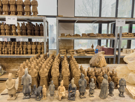 Terracota warriors, Clay figurines at various stages of production at a workshop in Xian town, Chinaの写真素材