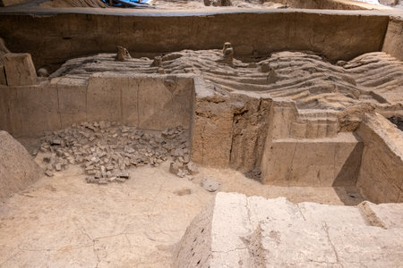 Terracotta Army Warriors archaeological site. Xian, China. Partially excavated section. Undulating earth covers buried fragmentsの写真素材