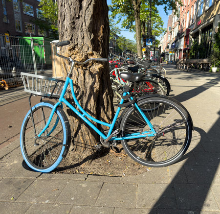 Bicycles parked at the city center, narrow pedestrian street and buildings background. Netherlands Hollandの写真素材