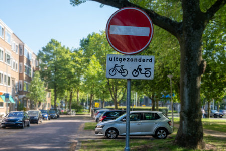 NO ENTRY traffic sign in Rotterdam city.Bikes, moto excluded dutch text. Netherlands Hollandの写真素材