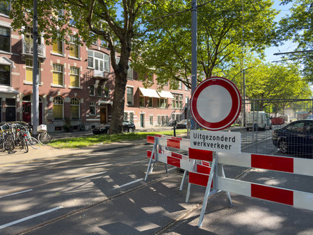 Road works in the city, street closed with barricade, NO ENTRY traffic sign and sign in Dutch, construction traffic excluded, text in Englishの写真素材