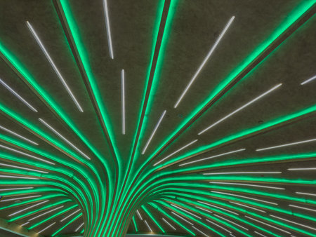 Modern ceiling installation with LED light strips. Futuristic interior lighting pattern, Contemporary public spaceの写真素材