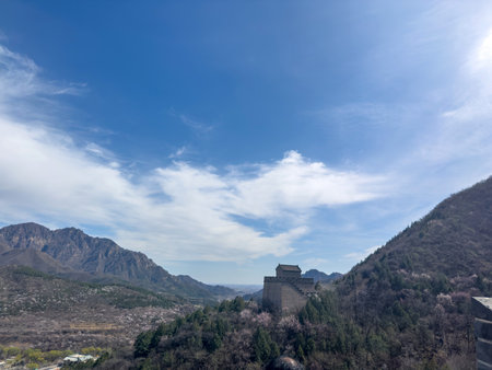 China. Great Wall, Stone watchtoweron rocky mountain landscape, cloudy blue sky,の写真素材