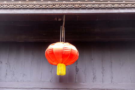 Red chinese lantern hanging from the roof. Traditional temple decorationの写真素材
