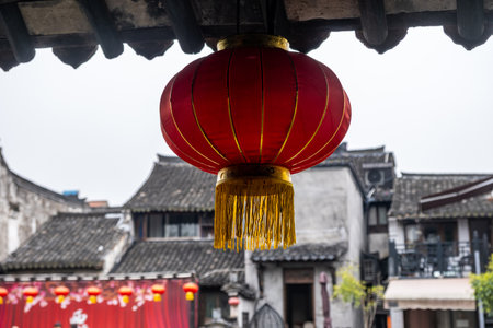 Red chinese lantern hanging from the roof. Traditional temple decorationの写真素材