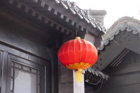 Red chinese lantern hanging from the roof. Traditional temple decorationの写真素材
