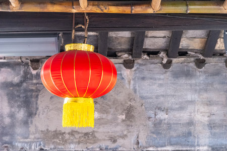 Red chinese lantern hanging from the roof. Traditional temple decorationの写真素材