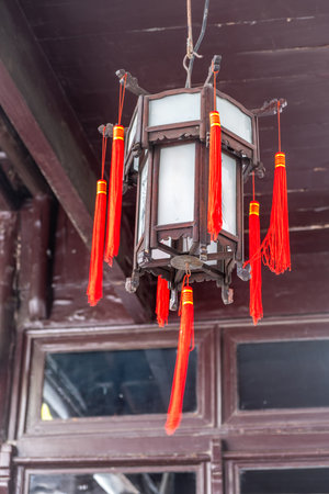Red chinese lantern hanging from the roof. Traditional temple decorationの写真素材