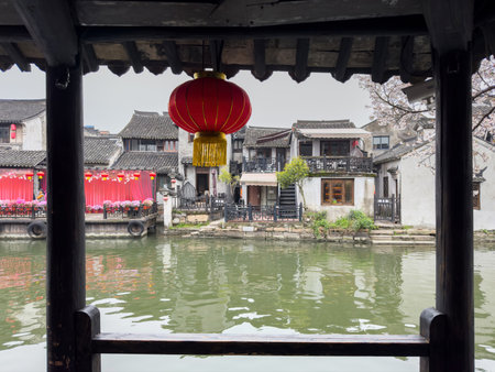 China water town Xitang. Traditional chinese red lantern and chinese architecture buildings on river banksの写真素材