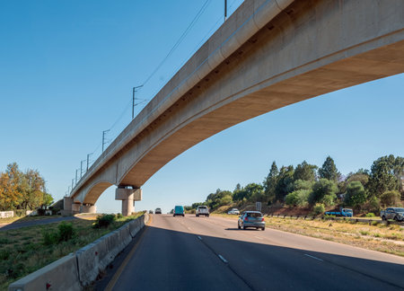 Concrete brigde over a highway in South Africa countryside. Sunny day, blue sky