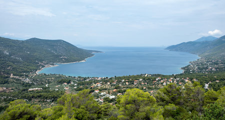 Aerial drone view of Porto Germeno bay Greece, turquoise waters, coastal villages, and surrounding...