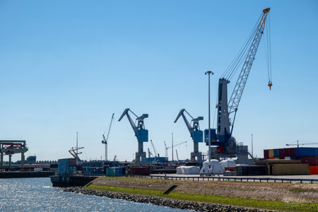 Port of Rotterdam, Netherlands. Cargo ships and cranes loading, Logistics industrial business