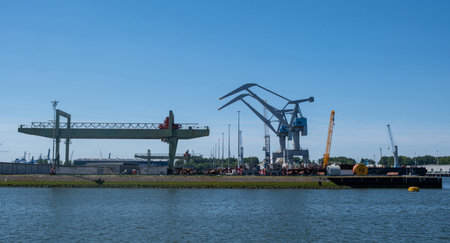 Port of Rotterdam, Netherlands. Cargo ships and cranes loading, Logistics industrial business
