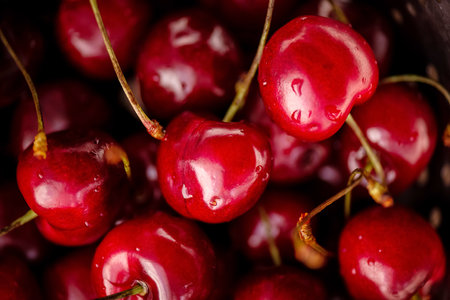 Ripe cherries on a black background. Summer conceptの写真素材