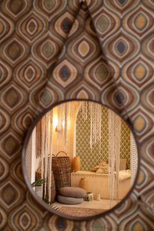 Middle east room interior reflecting in the mirror hanging on the wall