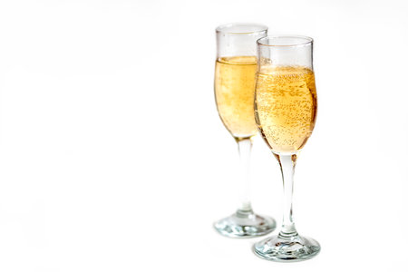 two glasses of champagne on white backgroundの写真素材