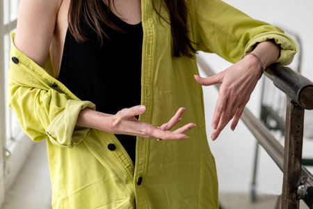 Woman gesturing with hands during talkingの写真素材
