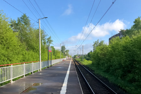 Empty countryside railway statoin platform. Public transport theme