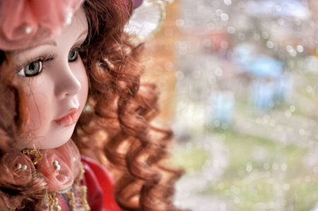 Close up porclain red hair doll faceの写真素材