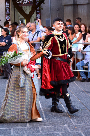 Teggiano, Italy - August 11, 2024, Medieval Festival: Everybody at the table with princess Costanza.のeditorial素材