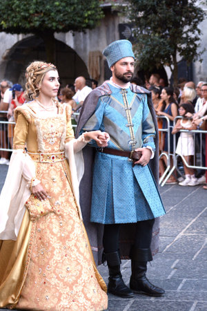 Teggiano, Italy - August 11, 2024, Medieval Festival: Everybody at the table with princess Costanza.のeditorial素材