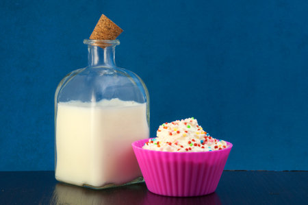 milk and whipped cream with colored sugarの写真素材