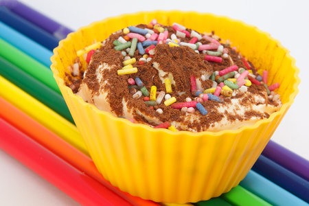 colorful cupcake with chocolate powder and sugar cropsの写真素材