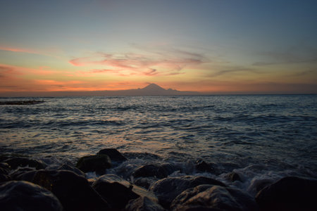 Bali volcano seen from the seaの写真素材