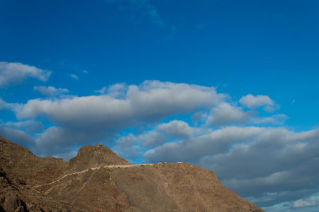 Las Teresitas beach mountain view in Tenerife, Canary Islands. Blue, cloudy sky.の写真素材