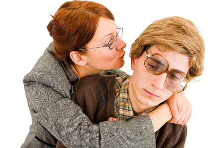 woman trying to kiss a nerd の写真素材