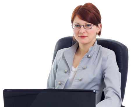 Beautiful businesswoman with laptop computer isolated on white の写真素材