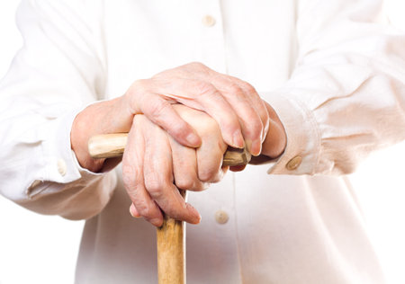hand of an old man in white, with isolated backgroundの写真素材