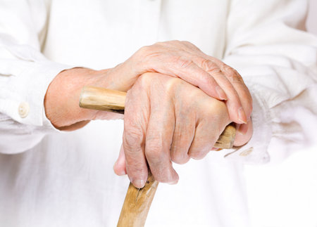 hand of an old man in white, with isolated backgroundの写真素材