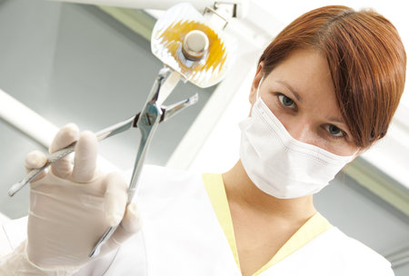 Portrait of a dentist in exam room の写真素材