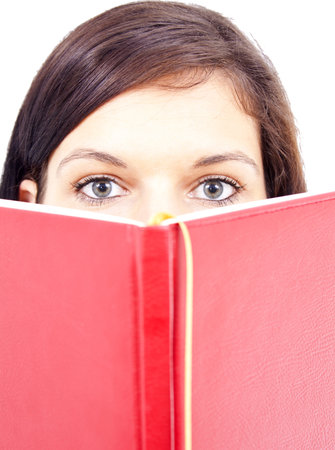 Beautiful girl reading from a dig bookの写真素材