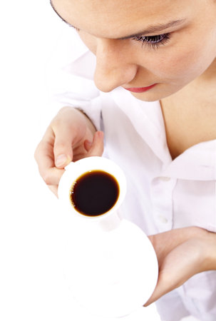 attractive woman in white shirt enjoying a  morning coffeeの写真素材