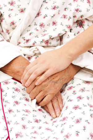 young hand taking care of and old oneの写真素材