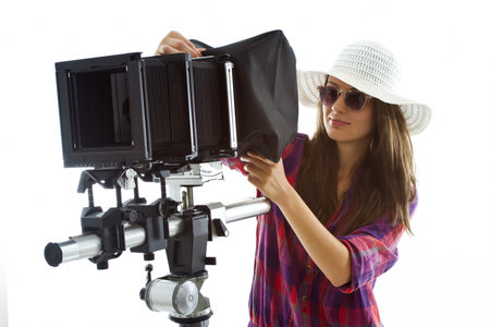 young girl with a proffessional analog photographic equipmentの写真素材