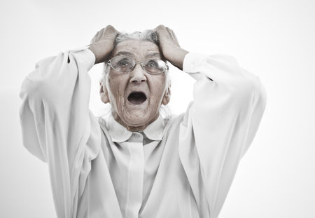 very old woman tearing her hair の写真素材