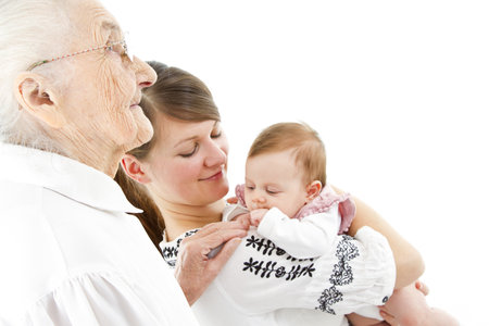 three generations of a family: baby, mother and great-grandmotherの写真素材