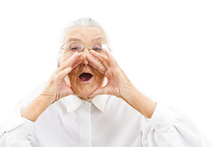 grandmother with funny expressions ona n isoltaed backgroundの写真素材