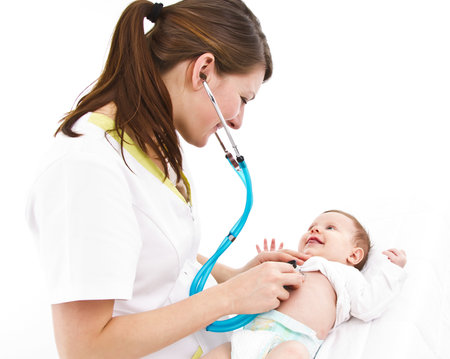 young doctor is examinating a little baby with a stethoscopeの写真素材