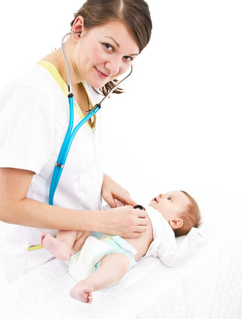 young doctor is examinating a little baby with a stethoscopeの写真素材