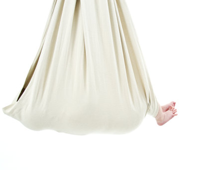 little baby in a hanging in an elastic wrap の写真素材