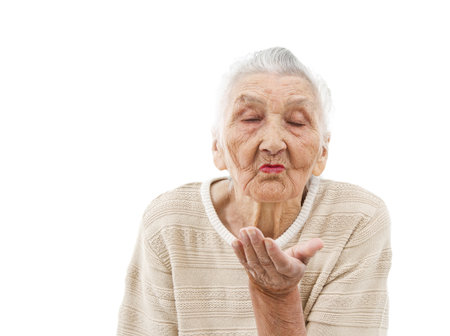 very old lady gives a kissの写真素材