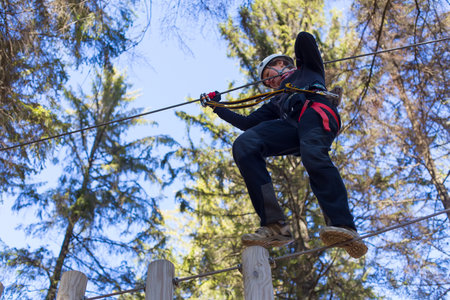 young woman having fun in an outdoor adventure park