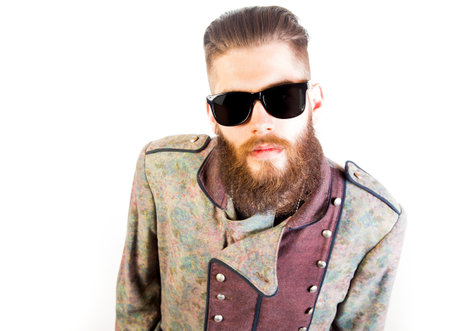 Man in strange outfit with sunglasses over isolated background.の写真素材