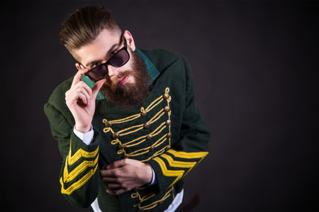 Hipster man posing being awesome with sunglasses.
