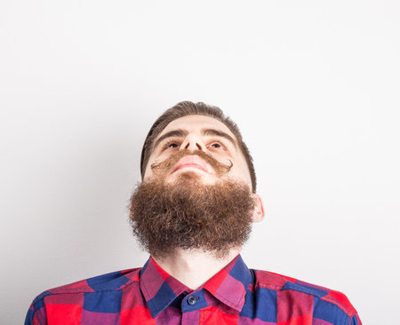 Image of a hipster from under his beard.の写真素材