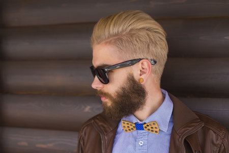 Fashionable young man representing the new generation's hipster style.の写真素材